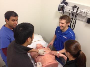 Four medical students in action