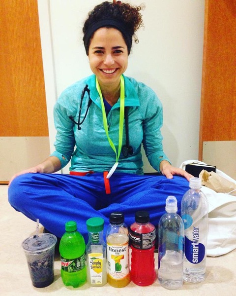 Resident sitting in front of a series of beverages