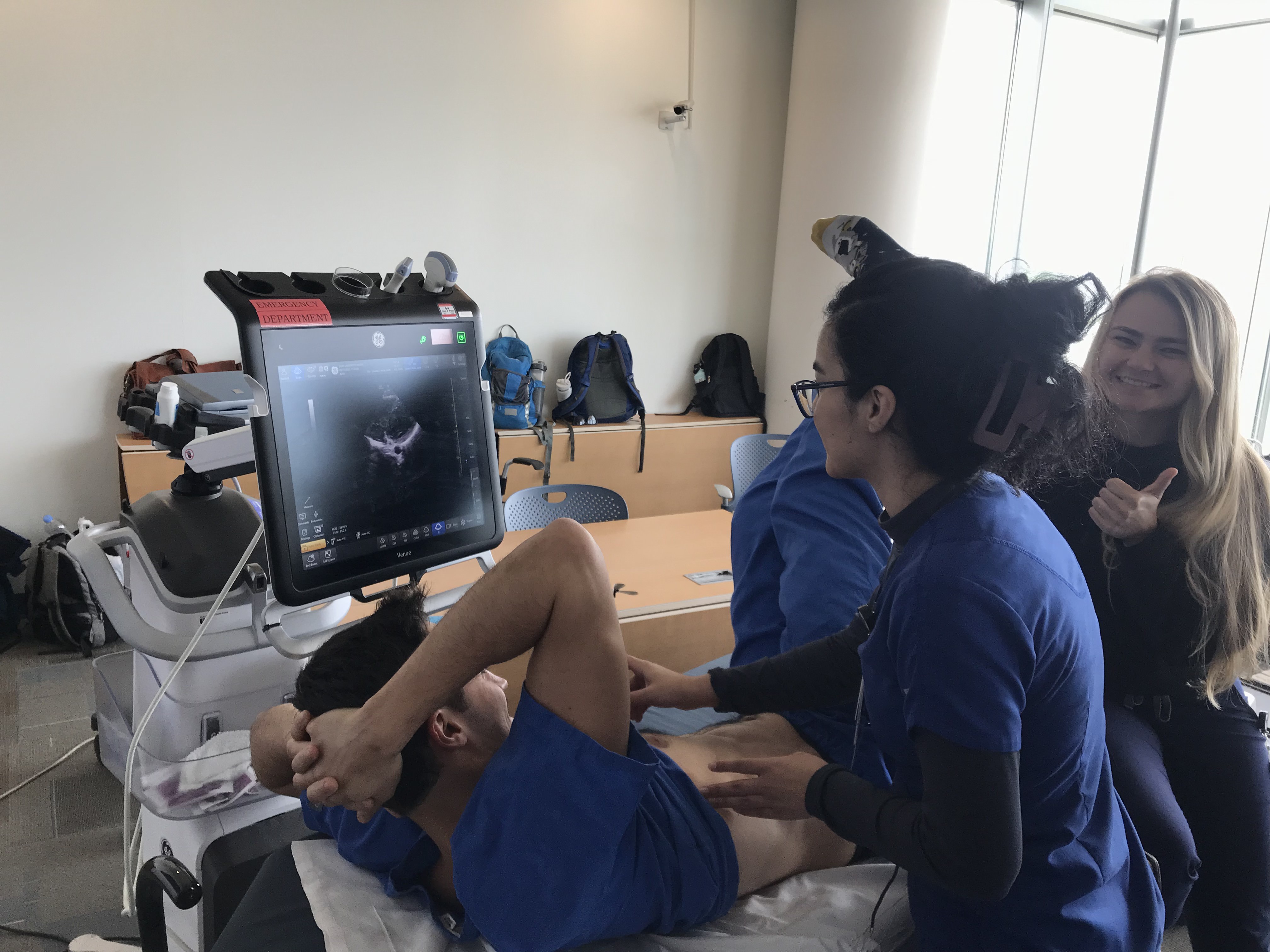 Doctors practicing ultrasound