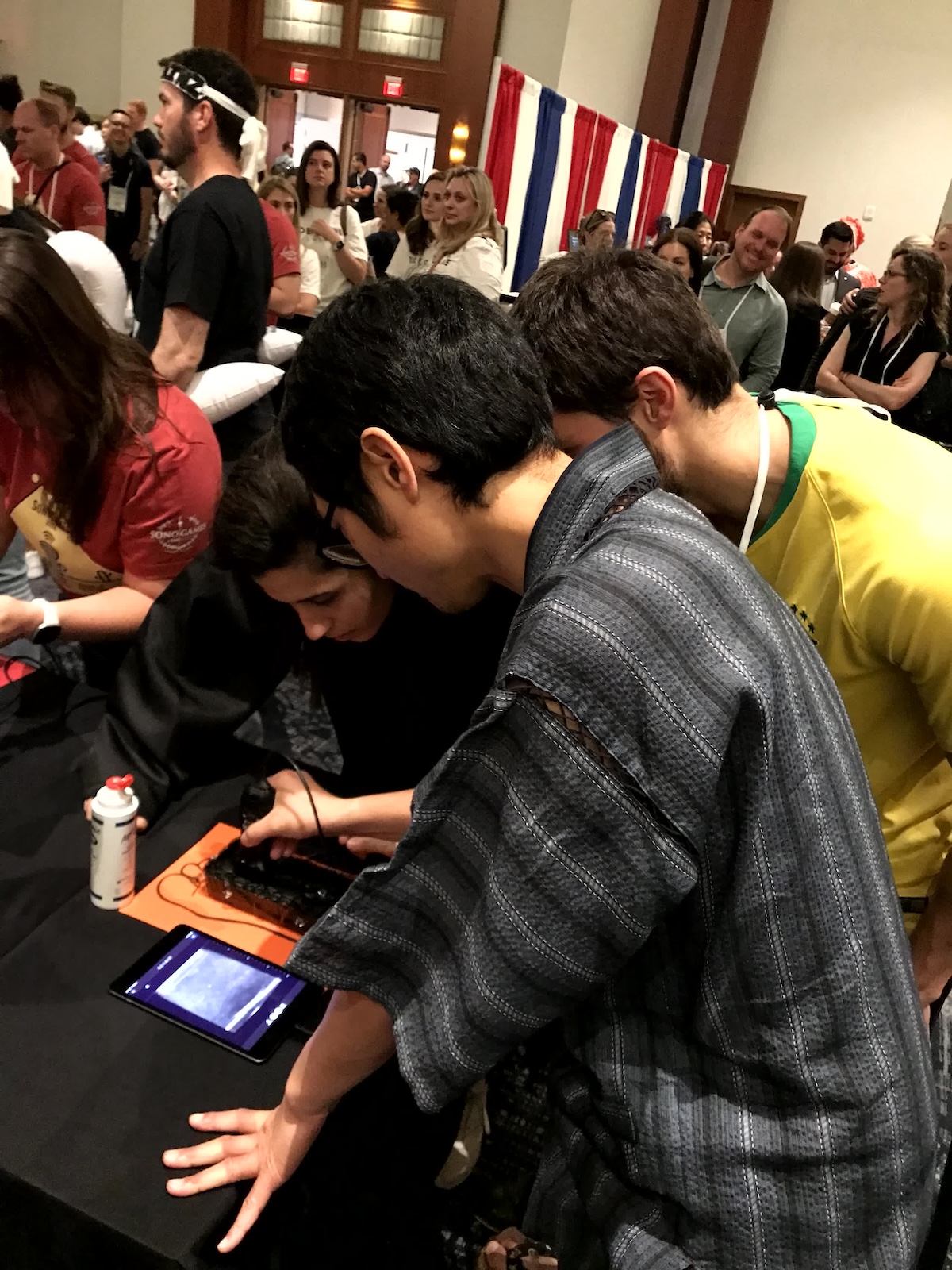 People looking at medical device