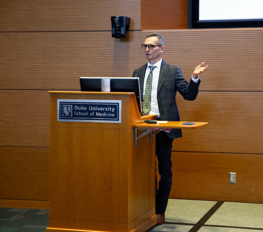 Charles Gerardo standing at a podium