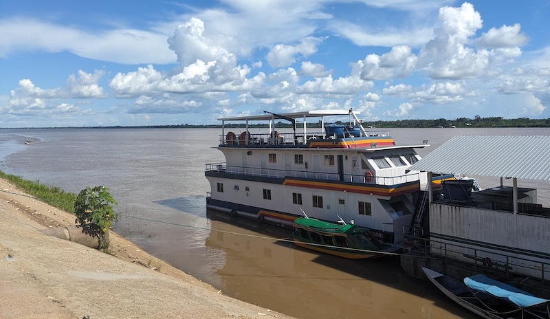 A docked mobile health unit visits riverside towns where health resources may be scarce or remote.