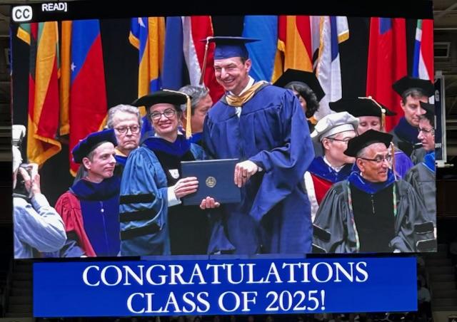 Graduate receiving a diploma