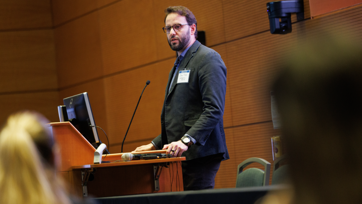 João Vissoci speaking at the Duke University School of Medicine Climate & Health Symposium in January 2026.