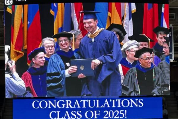 Graduate receiving a diploma