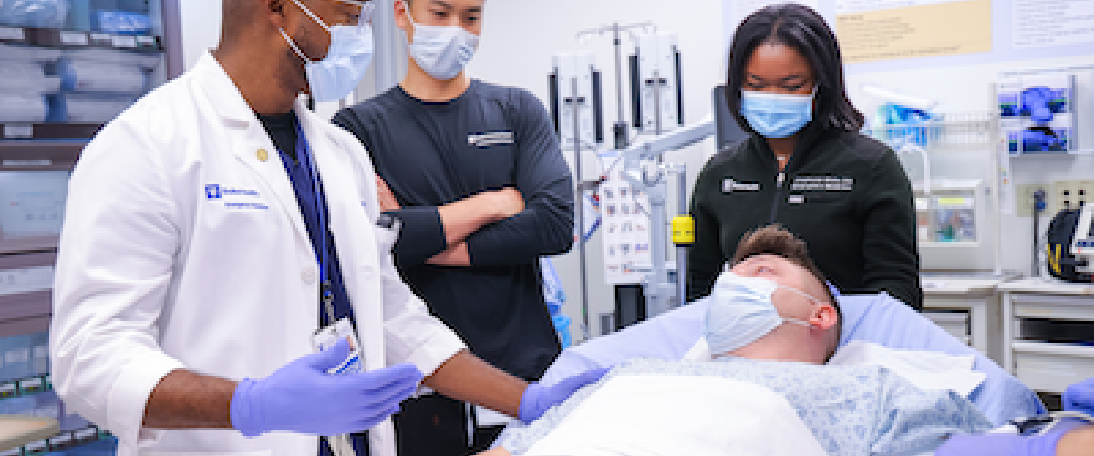 Dr. Kendrick Kennedy conducts training for Emergency Medicine resident physicians