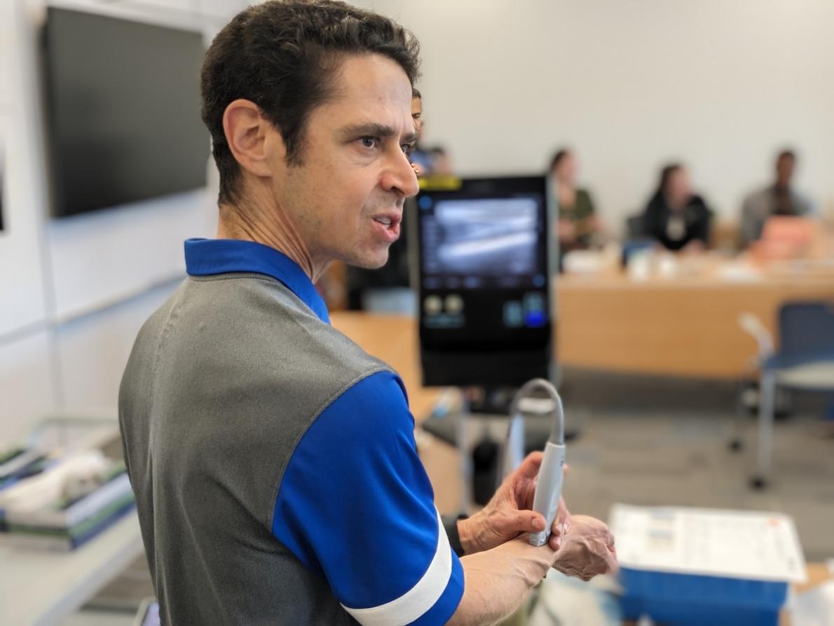 Dr. Josh Broder, Vice Chair of Education and Residency Program Director, demonstrates a simulation for the residents.