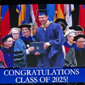 Graduate receiving a diploma